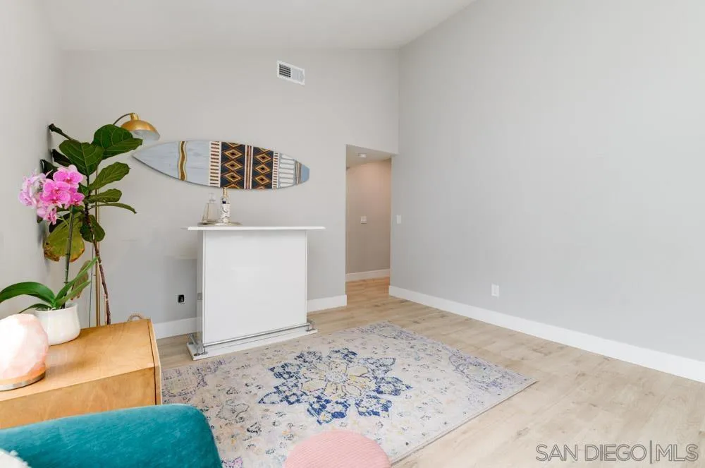 1955 Village Wood Road Encinitas, CA 92024 - Photo 13 of 31 a living room with furniture and flowers