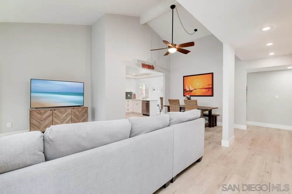 1955 Village Wood Road Encinitas, CA 92024 - Photo 2 of 31 a living room with furniture a ceiling fan and a wooden floor