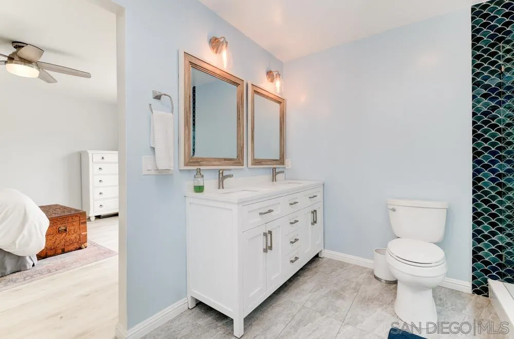 1955 Village Wood Road Encinitas, CA 92024 - Photo 25 of 31 a bathroom with a sink toilet and mirror