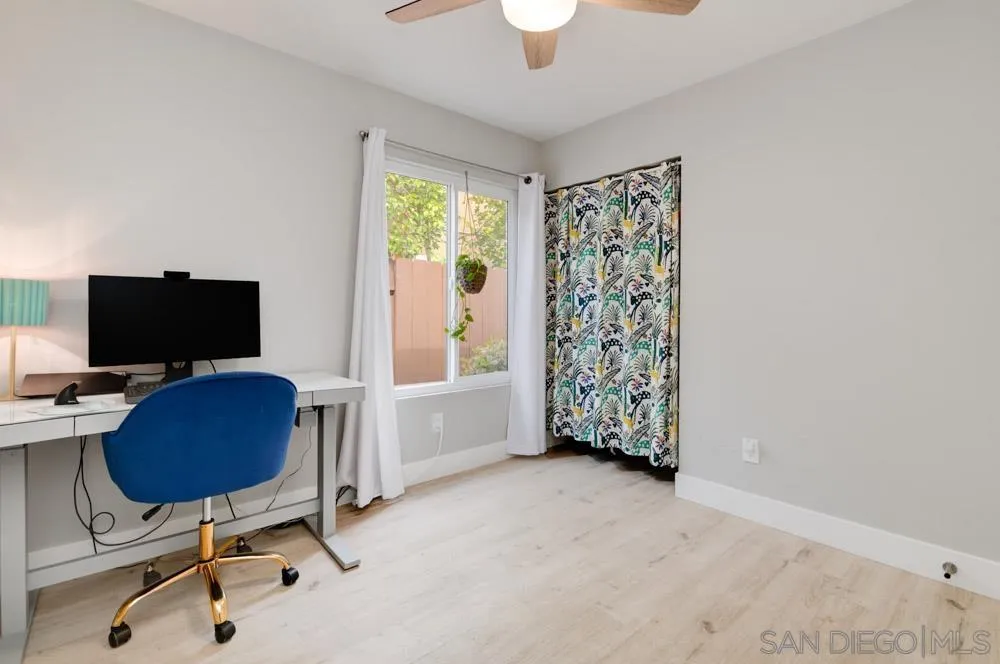 1955 Village Wood Road Encinitas, CA 92024 - Photo 26 of 31 a view of a livingroom with workspace and a window