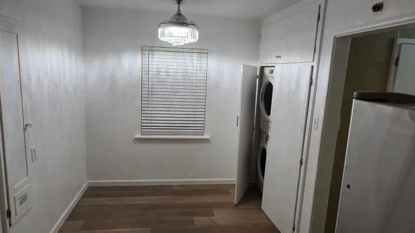 a view of hallway with wooden floor