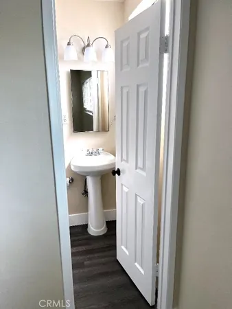 a white toilet sitting next to a bathroom sink