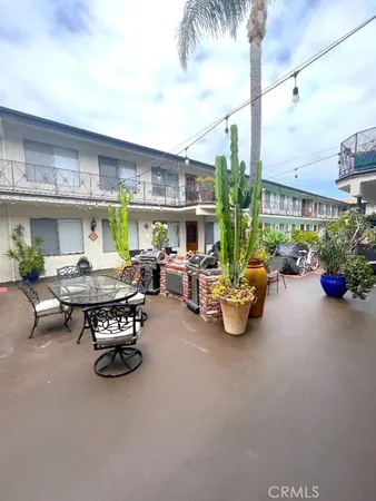 a terrace with a table and chairs