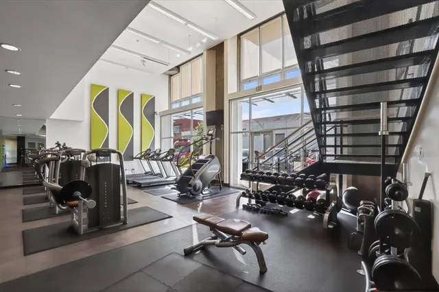 a living room with furniture a dining table and chairs
