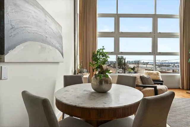 a kitchen with stainless steel appliances a sink stove and microwave