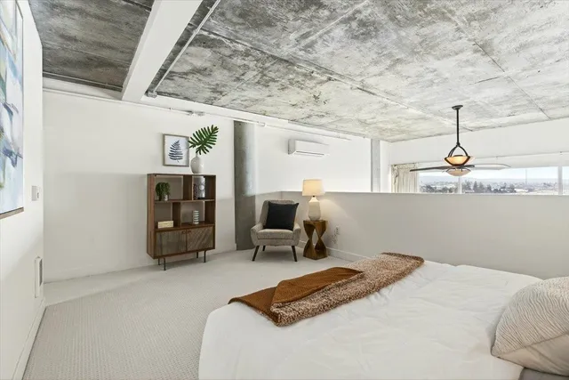 a bedroom with a bed and cabinets