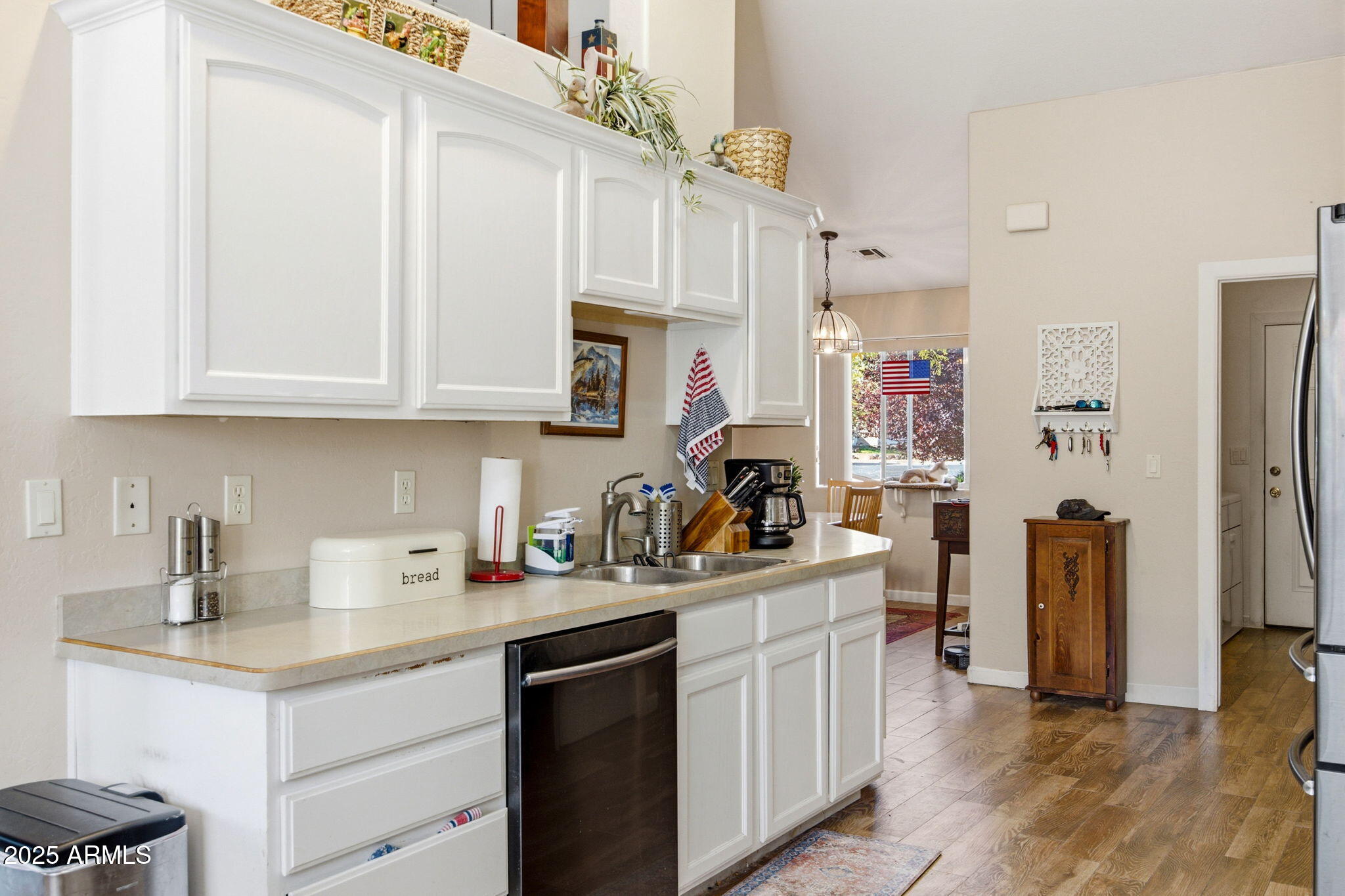 1880 West Merrill Show Low, AZ 85901 - Photo 13 of 31 a kitchen with stainless steel appliances granite countertop a sink stove and refrigerator