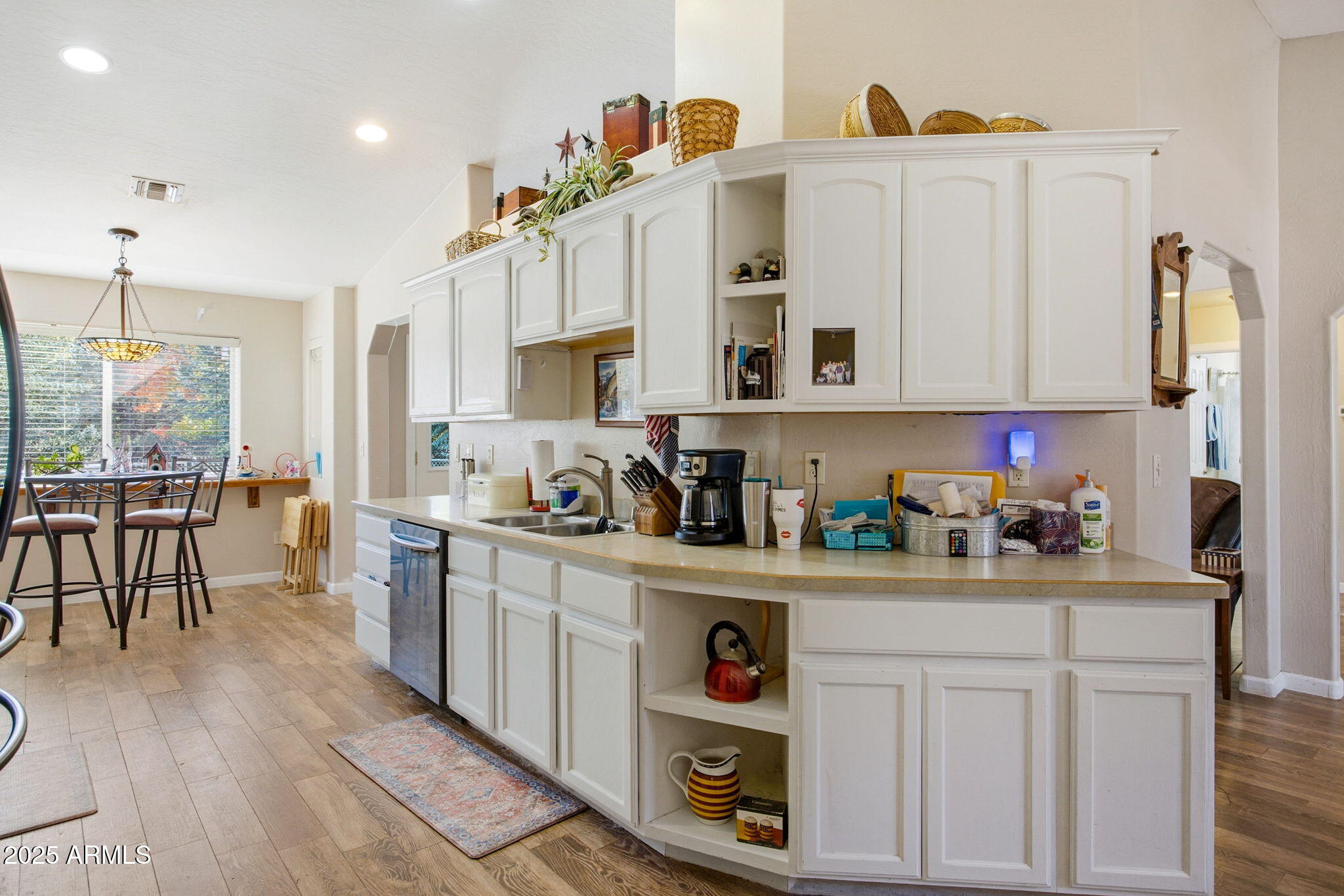 1880 West Merrill Show Low, AZ 85901 - Photo 15 of 31 a kitchen with stainless steel appliances a white cabinets and wooden floor
