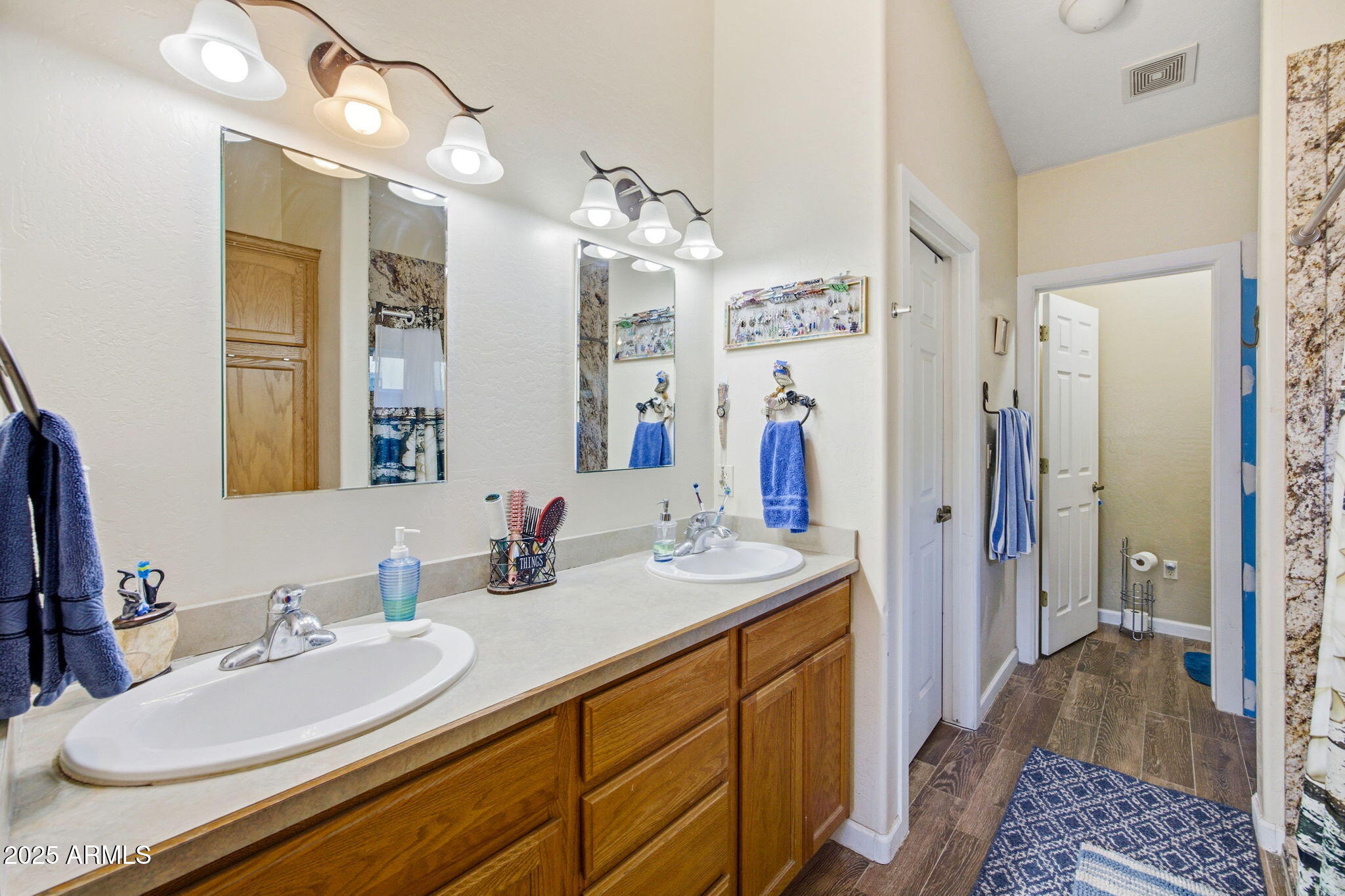 1880 West Merrill Show Low, AZ 85901 - Photo 20 of 31 a bathroom with a sink double vanity granite tub shower and a mirror