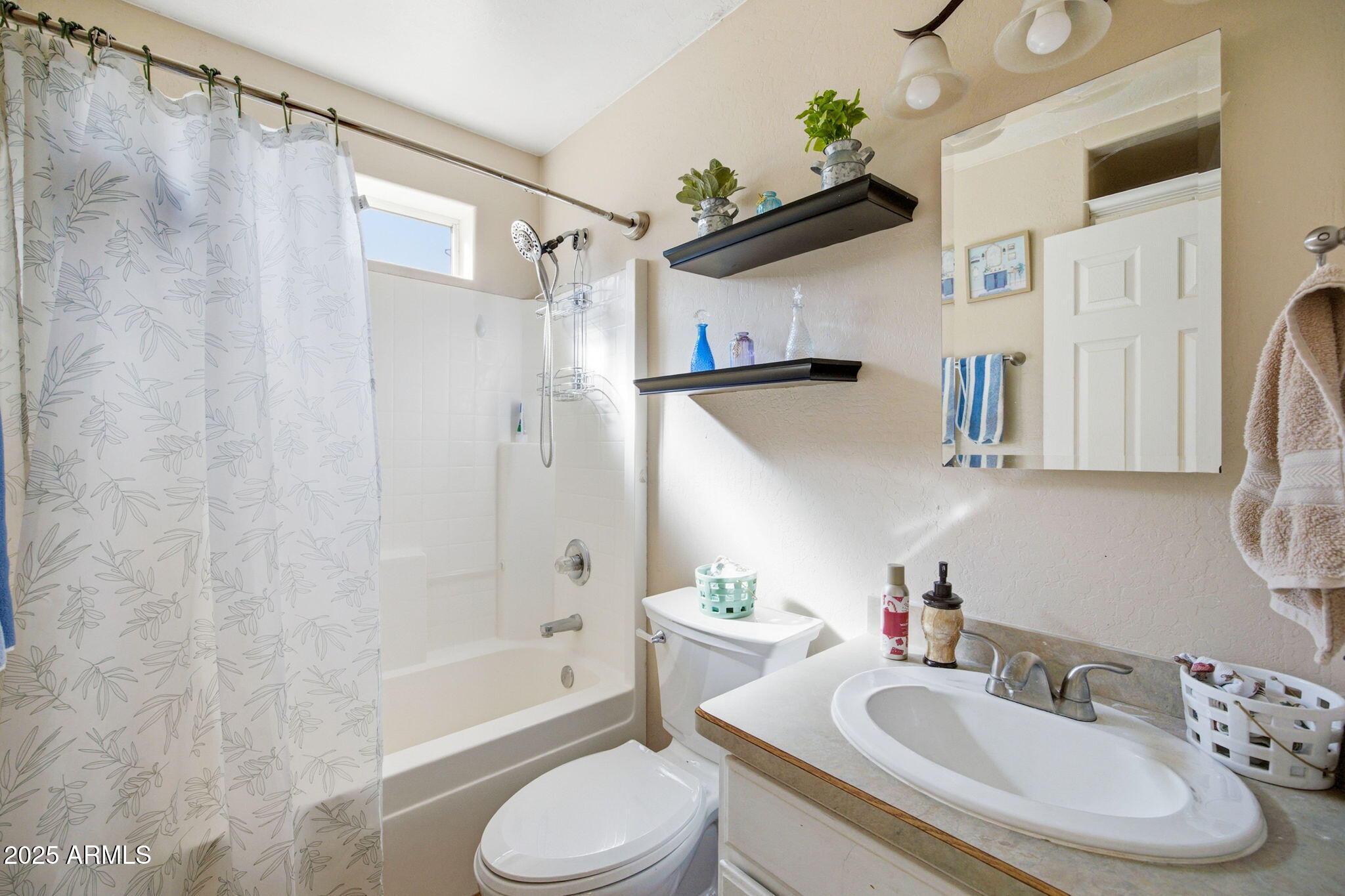1880 West Merrill Show Low, AZ 85901 - Photo 23 of 31 a bathroom with a sink toilet and shower