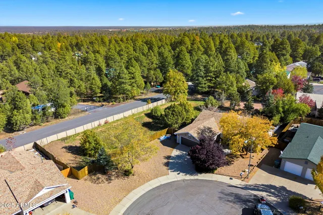 a view of a swimming pool with a yard