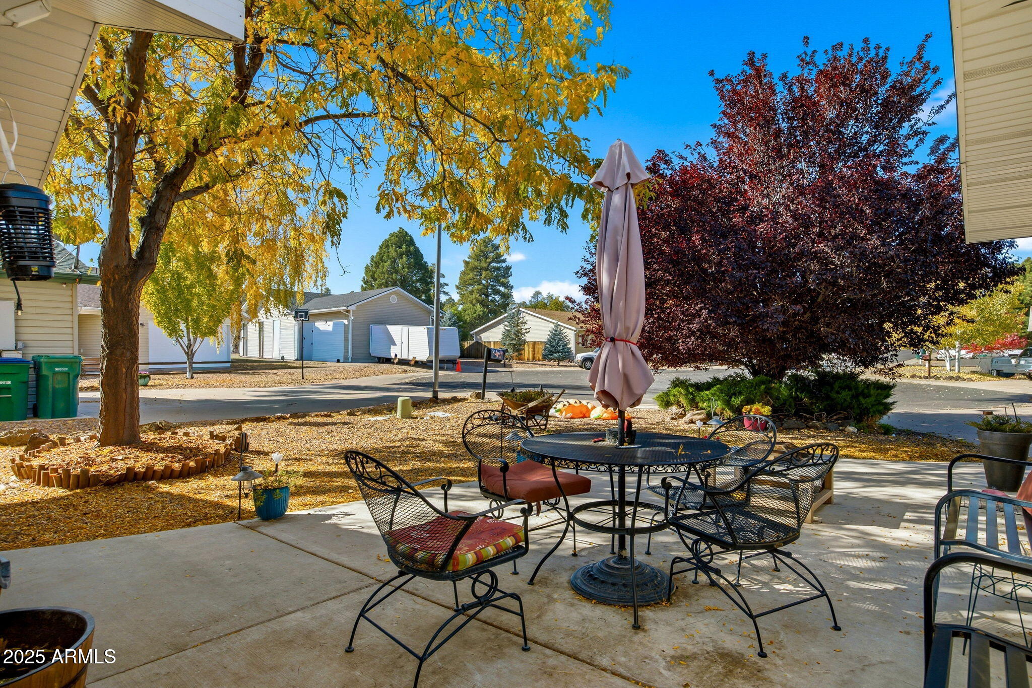 1880 West Merrill Show Low, AZ 85901 - Photo 4 of 31 a view of a swimming pool with a table and chairs