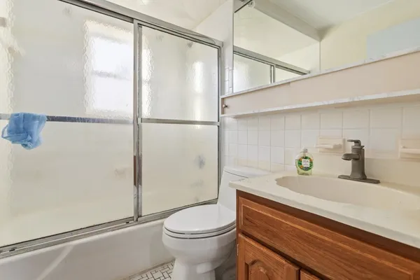 a view of cars parked on the street side