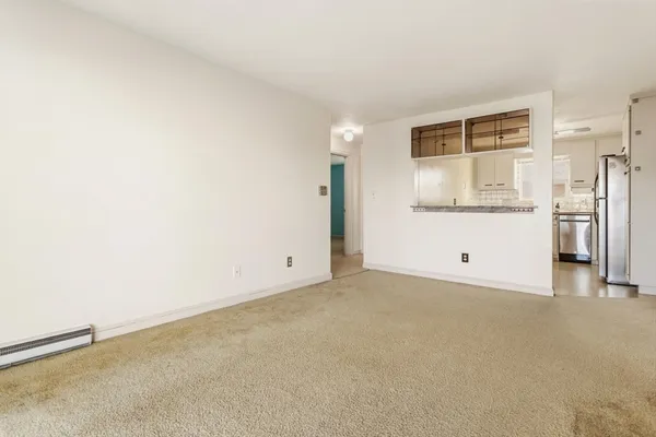 a view of a kitchen with a refrigerator