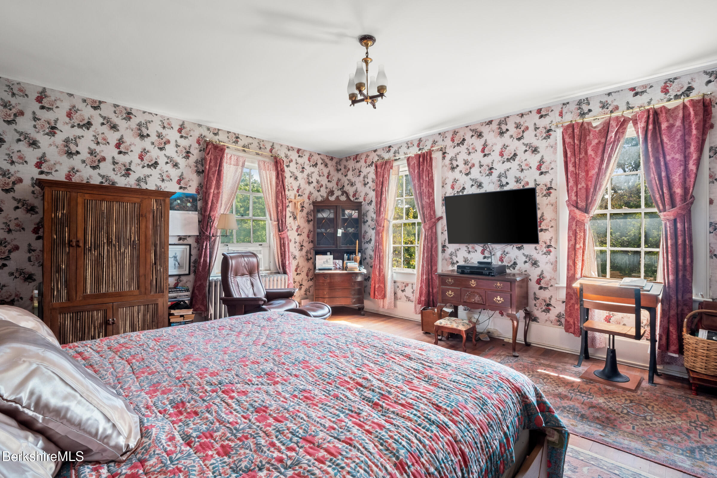 535 Main Road Monterey, MA 01245 - Photo 25 of 45 a bedroom with a bed and a flat screen tv