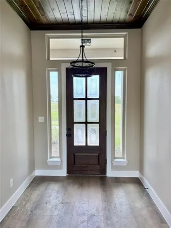 a view of room with a ceiling fan and window