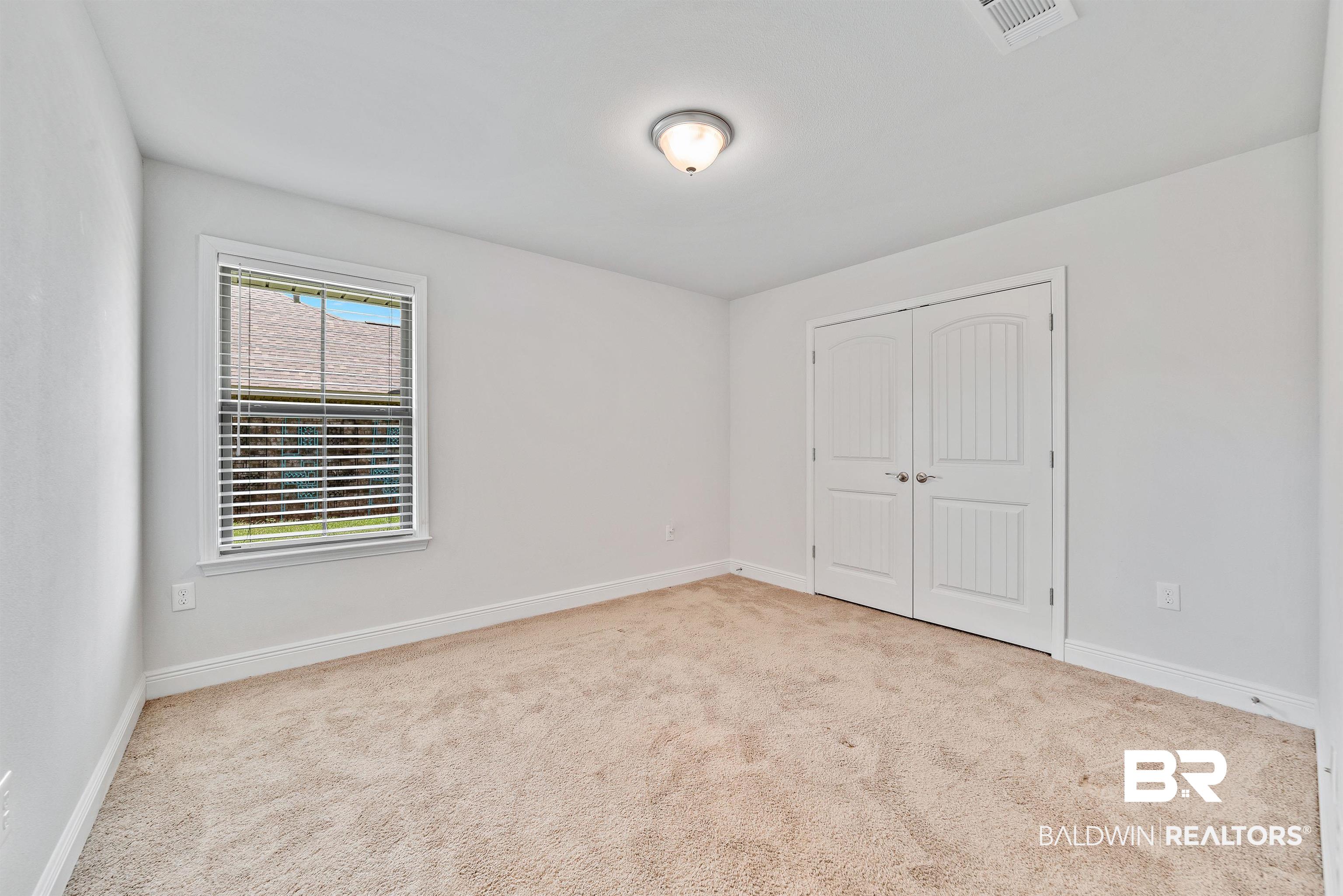 13155 Wishbone Court Foley, AL 36535 - Photo 27 of 39 View of carpeted empty room