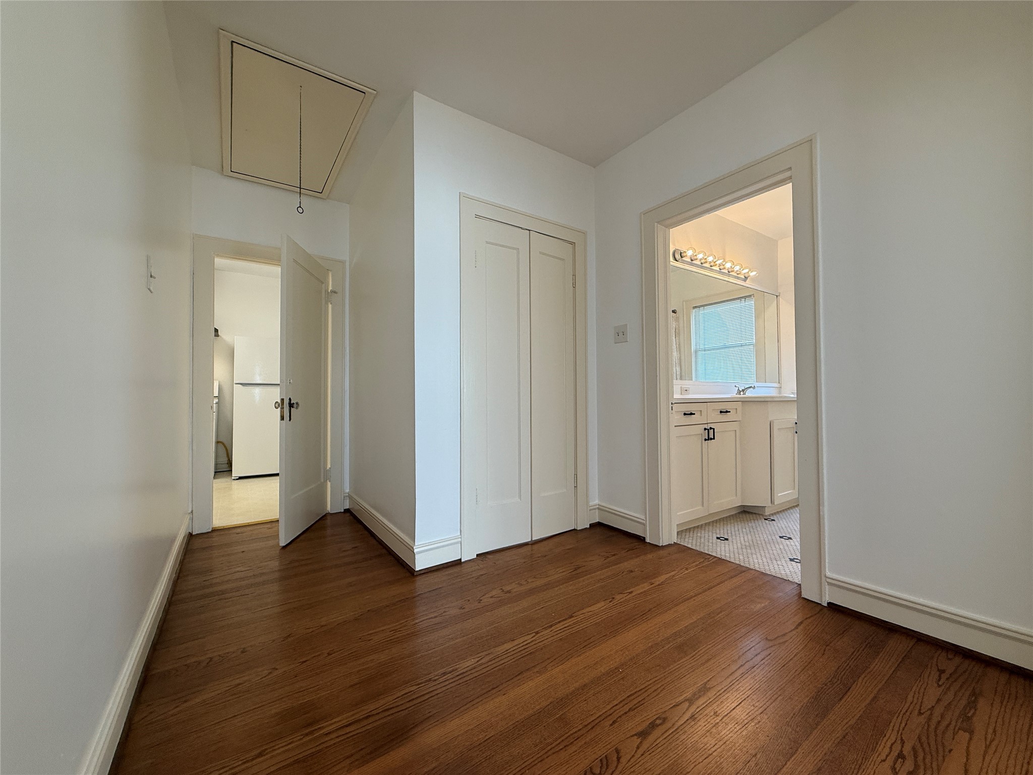 2311 Wroxton Road Houston, TX 77005 - Photo 15 of 24 From the living room, double doors open into the hallway.