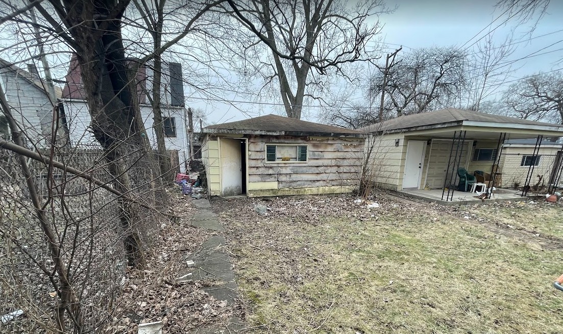 5604 South May Street Chicago, IL 60621 - Photo 3 of 9 a view of a house with a yard