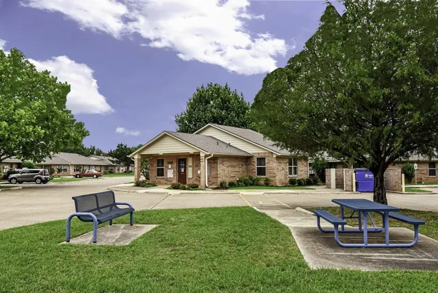 a swimming pool with outdoor seating and yard