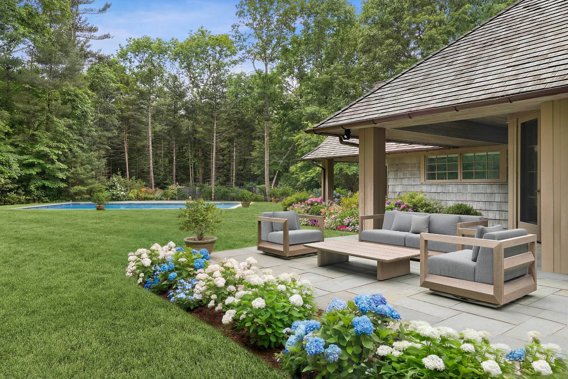 211 Swamp Road East Hampton, NY 11937 - Photo 6 of 23 a front view of a house with garden and porch