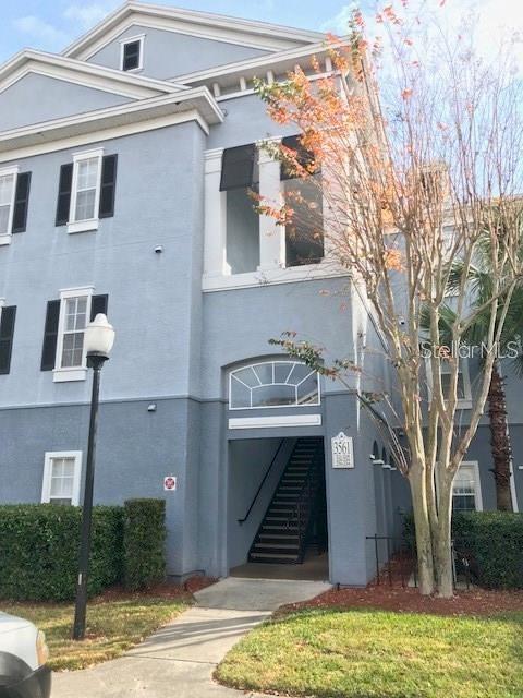 3561 Conroy Road, Unit 212 Orlando, FL 32839 - Photo 1 of 1 a front view of a house with a yard