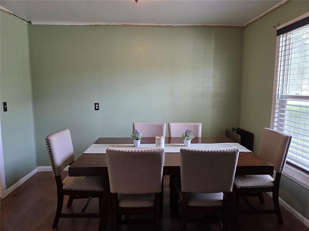 124 East F Street Frostproof, FL 33843 - Photo 9 of 37 a view of a dining room with furniture and window