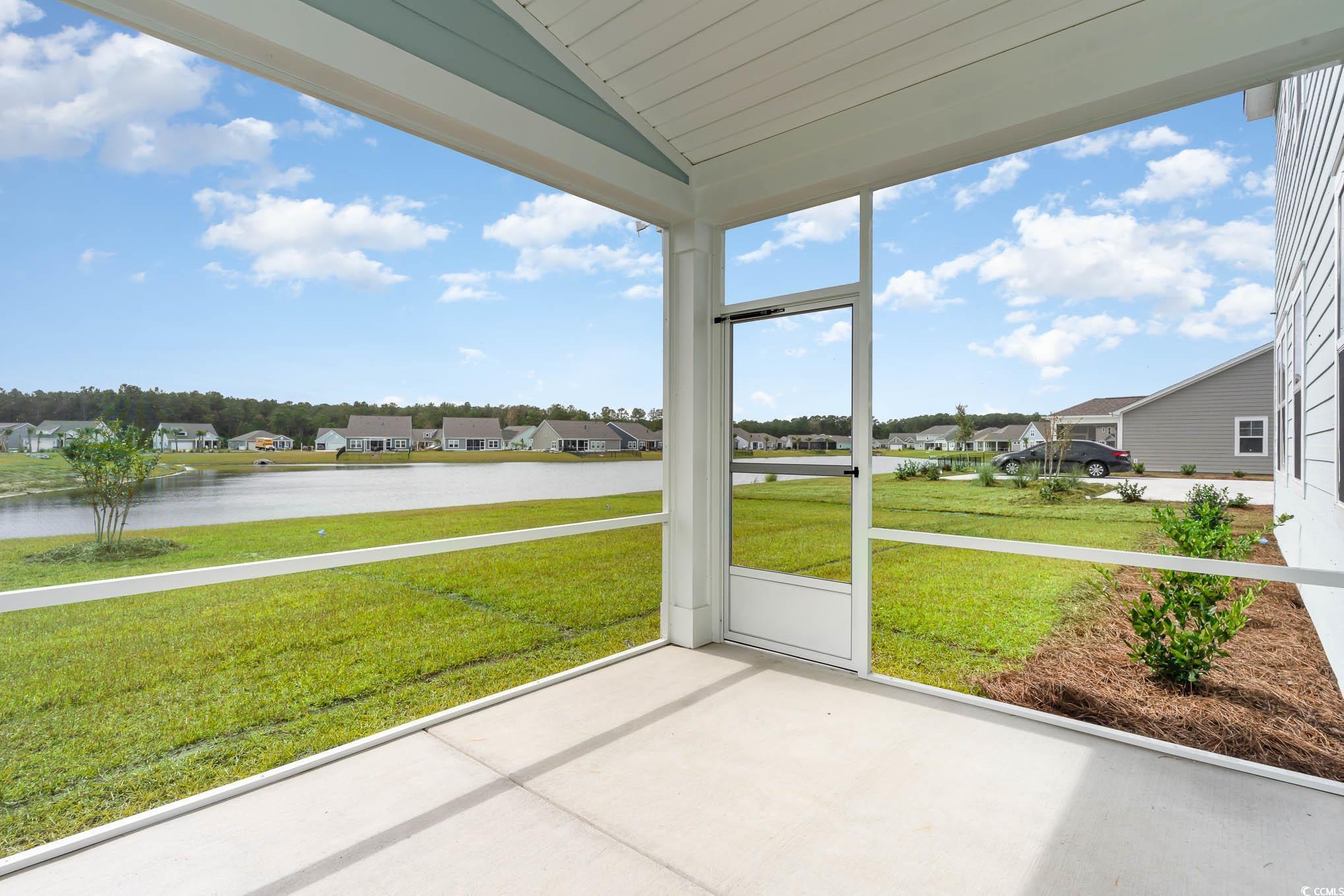 135 Stride Court Myrtle Beach, SC 29588 - Photo 30 of 36 Unfurnished sunroom with vaulted ceiling, a water view, and a residential view
