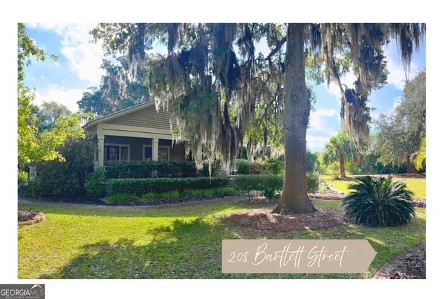 a view of a house with swimming pool and a yard