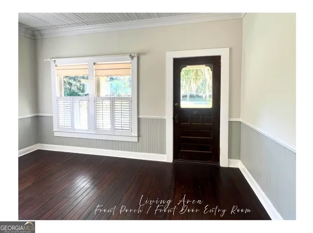 a kitchen with granite countertop a refrigerator and a sink