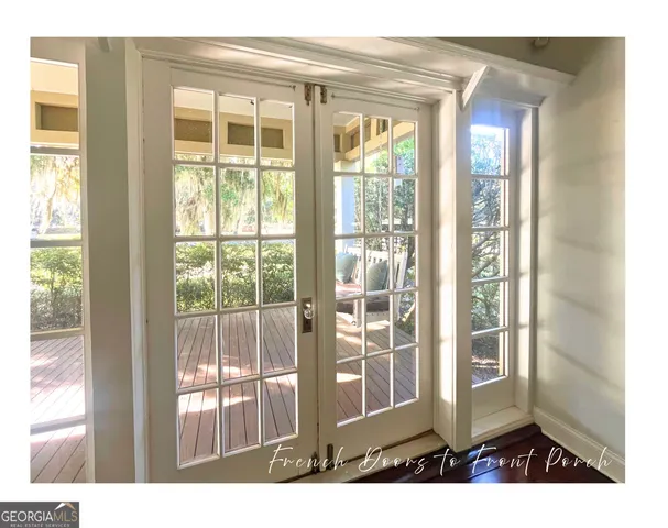a view of entryway with stairs and a chandelier fan