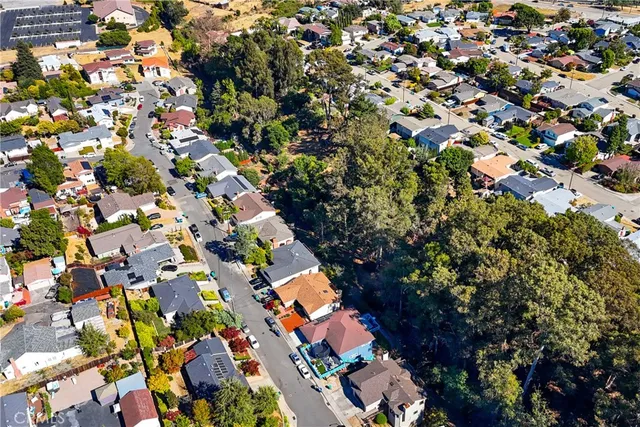 an aerial view of residential houses with outdoor space
