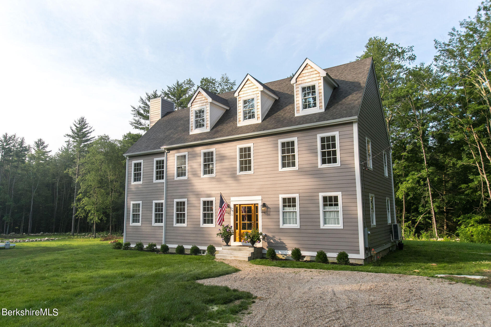 897 Canaan Valley Road New Marlborough, MA 01259 - Photo 2 of 50 a front view of a house with a garden
