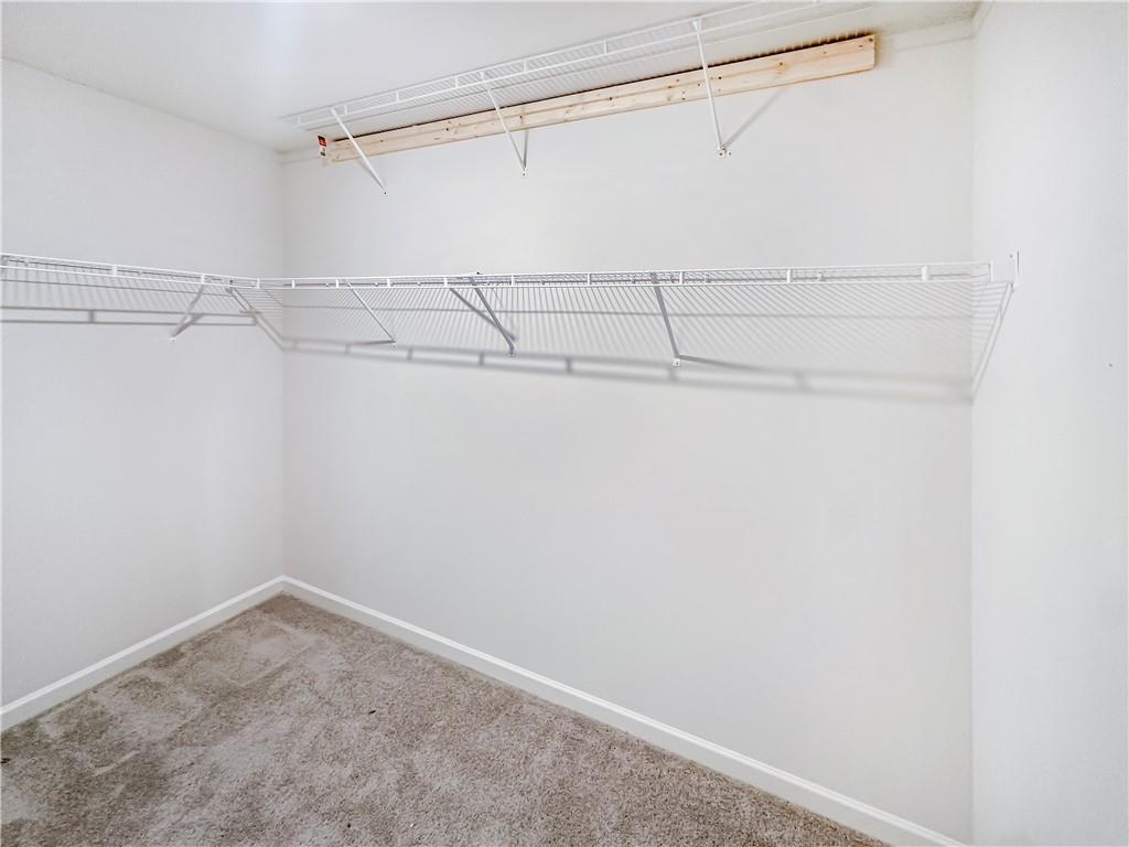 965 Athena Bend Fairburn, GA 30213 - Photo 27 of 37 a view of a room with racks on the wall