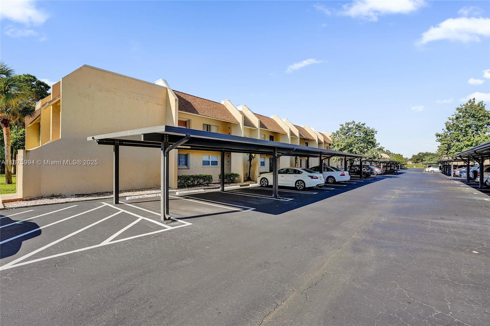 a view of a house with pool and sitting area