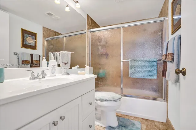 a view of flowing water with large building in front of it