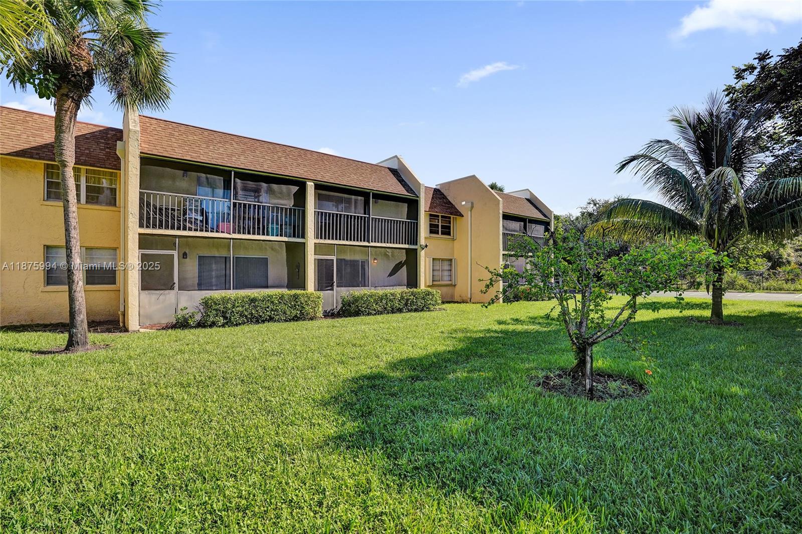 2975 Southwest 22nd Avenue, Unit 102 Delray Beach, FL 33445 - Photo 51 of 73 a house view with a garden space