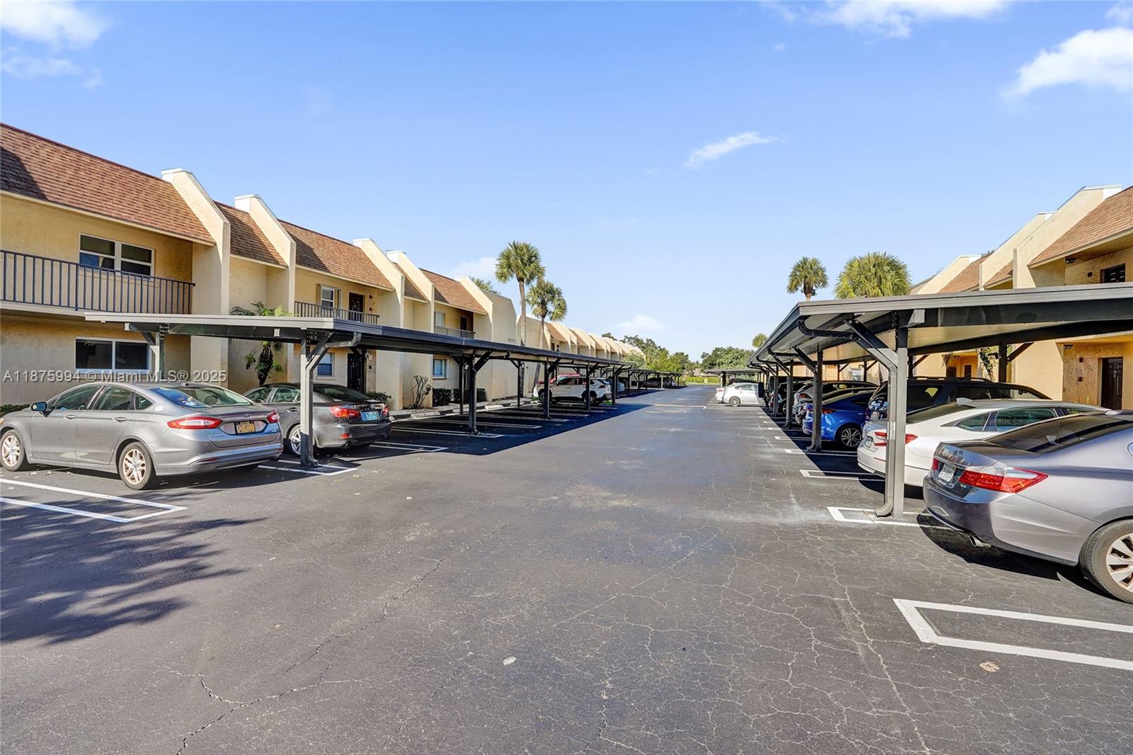2975 Southwest 22nd Avenue, Unit 102 Delray Beach, FL 33445 - Photo 62 of 73 a view of street with cars