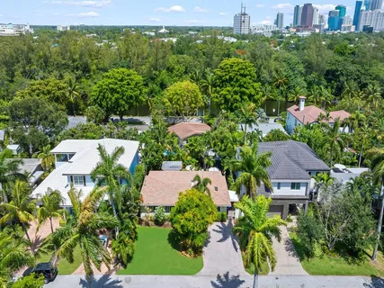 an aerial view of a house with yard swimming pool and outdoor seating
