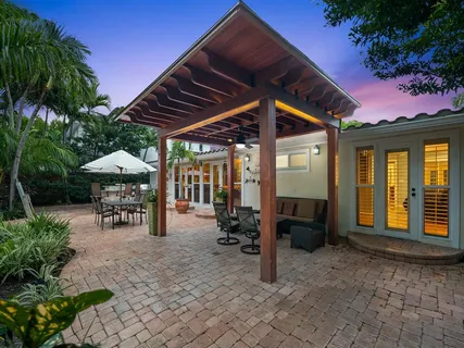 a view of a chairs and table in patio