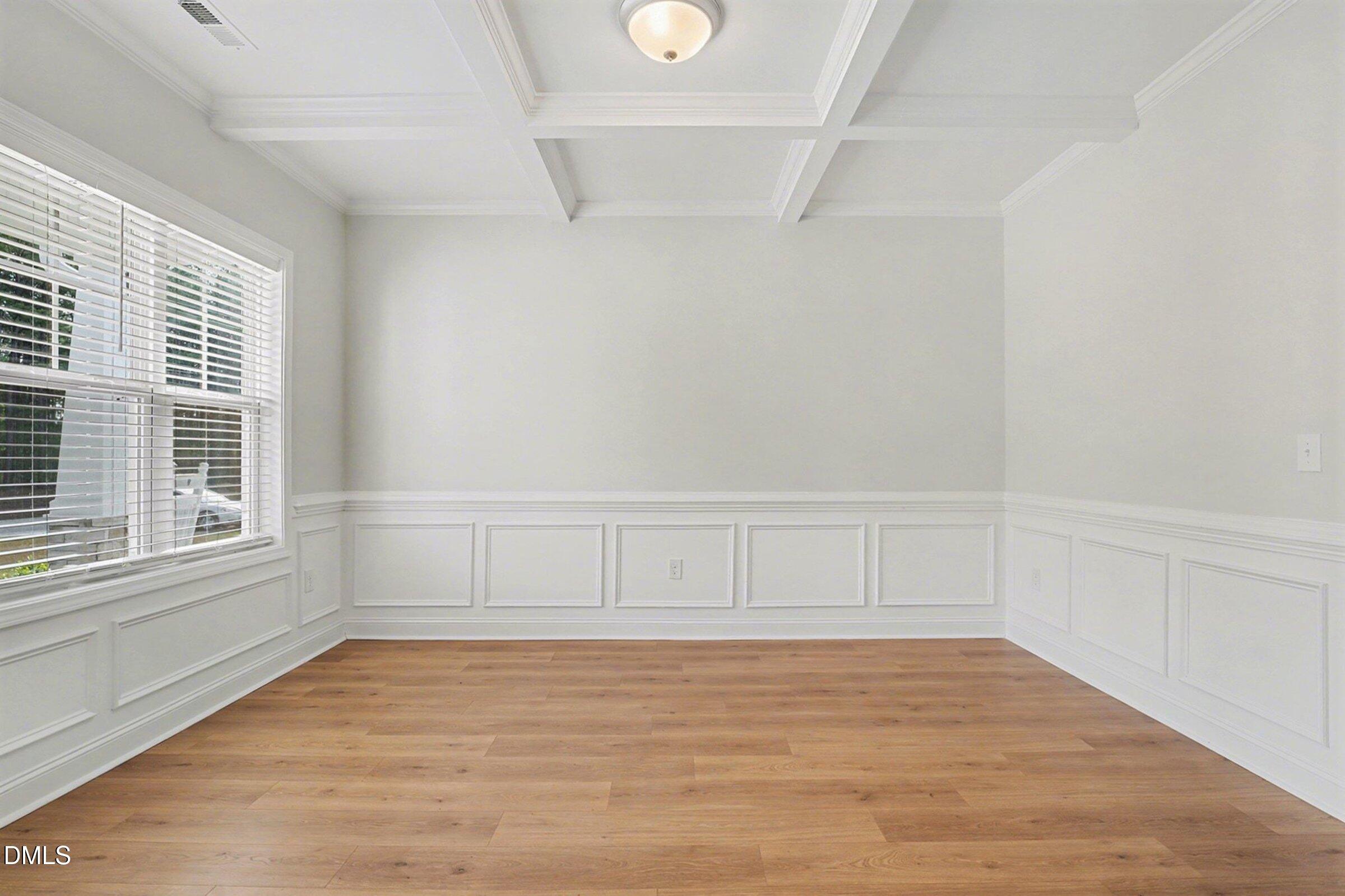 2815 Lemuel Black Road Spring Lake, NC 28390 - Photo 22 of 37 a view of an empty room with wooden floor and windows