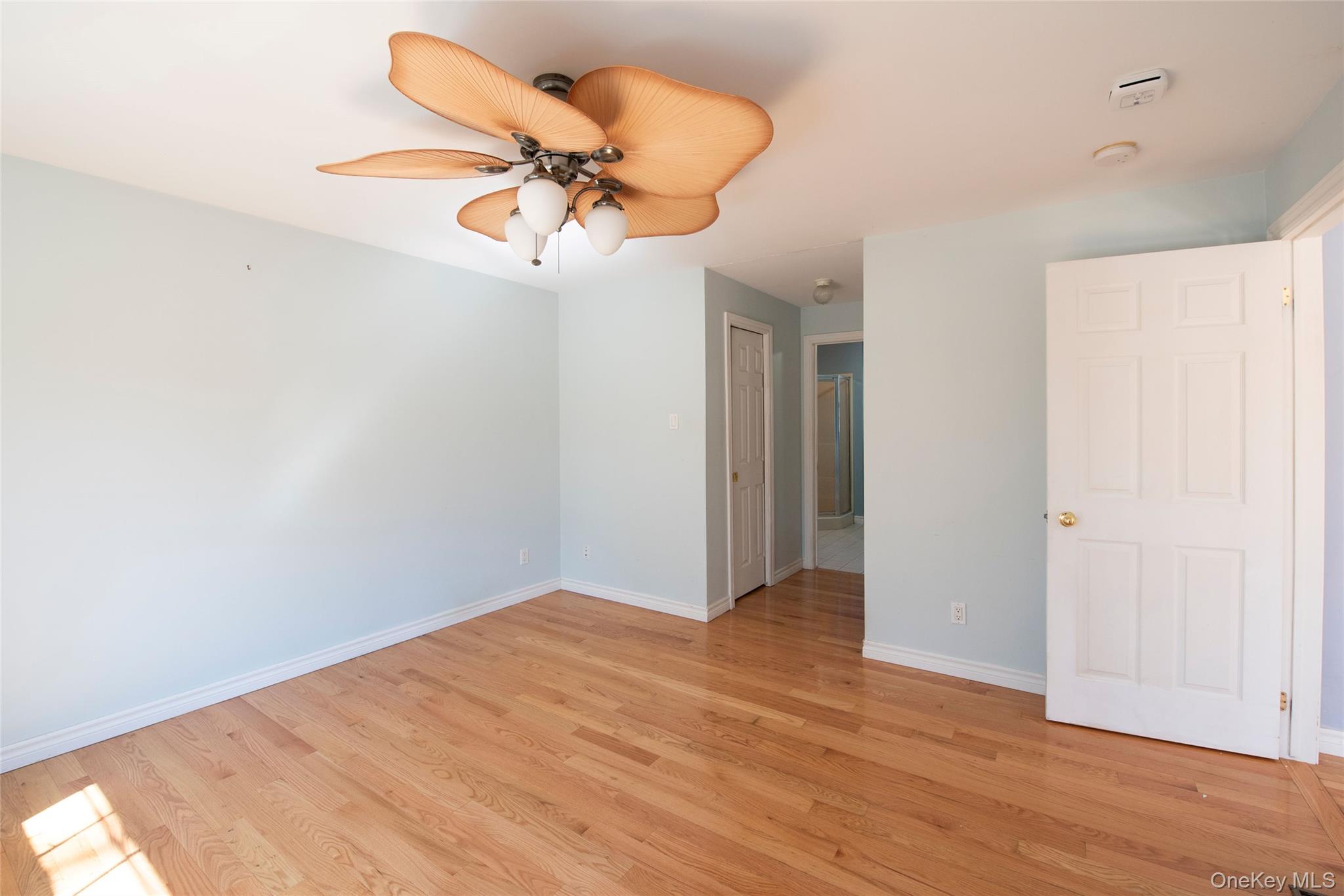 212 Rhinecliff Road Rhinebeck, NY 12572 - Photo 12 of 18 a view of a room with wooden floor and ceiling fan