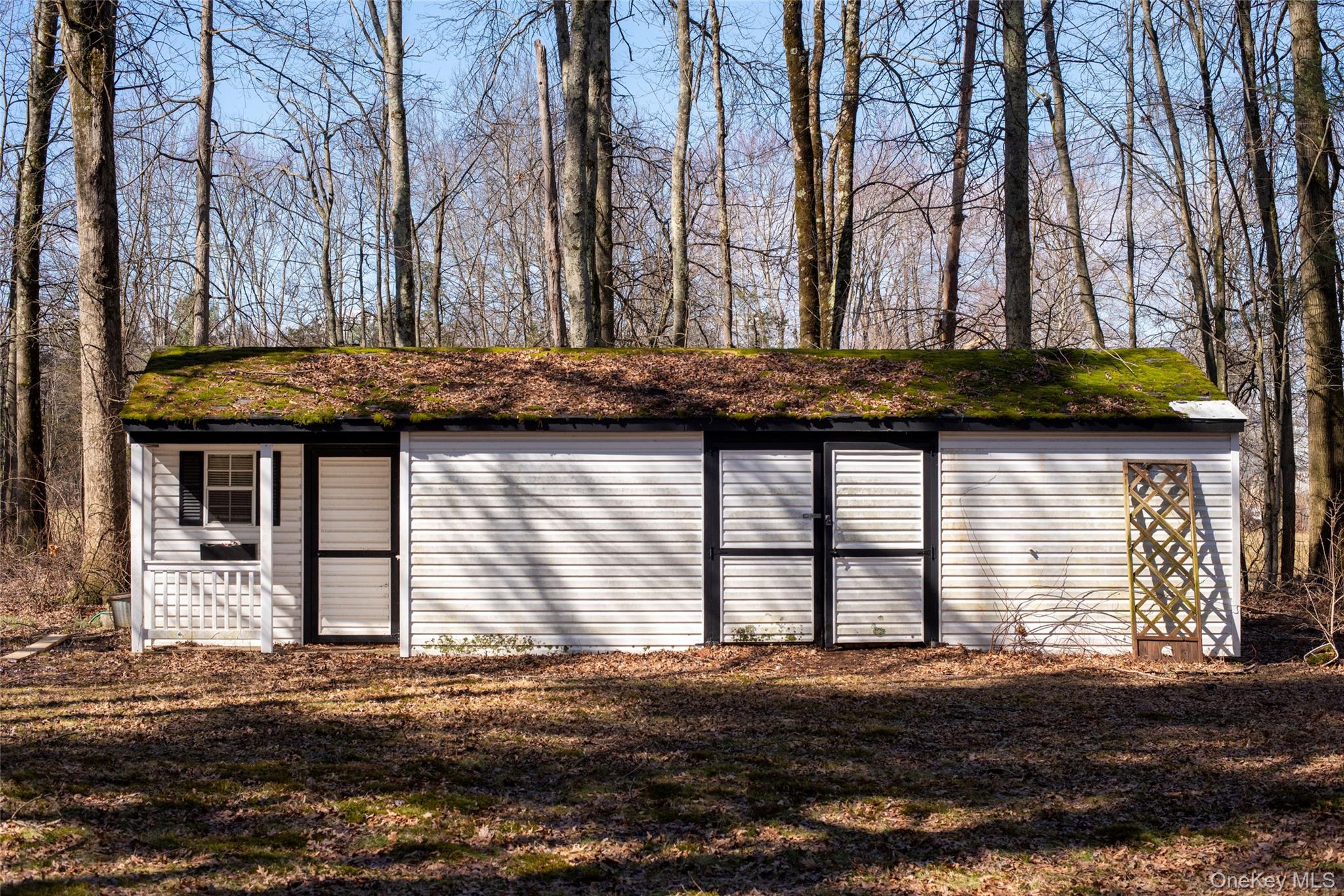 212 Rhinecliff Road Rhinebeck, NY 12572 - Photo 18 of 18 a view of a house with a yard and large tree
