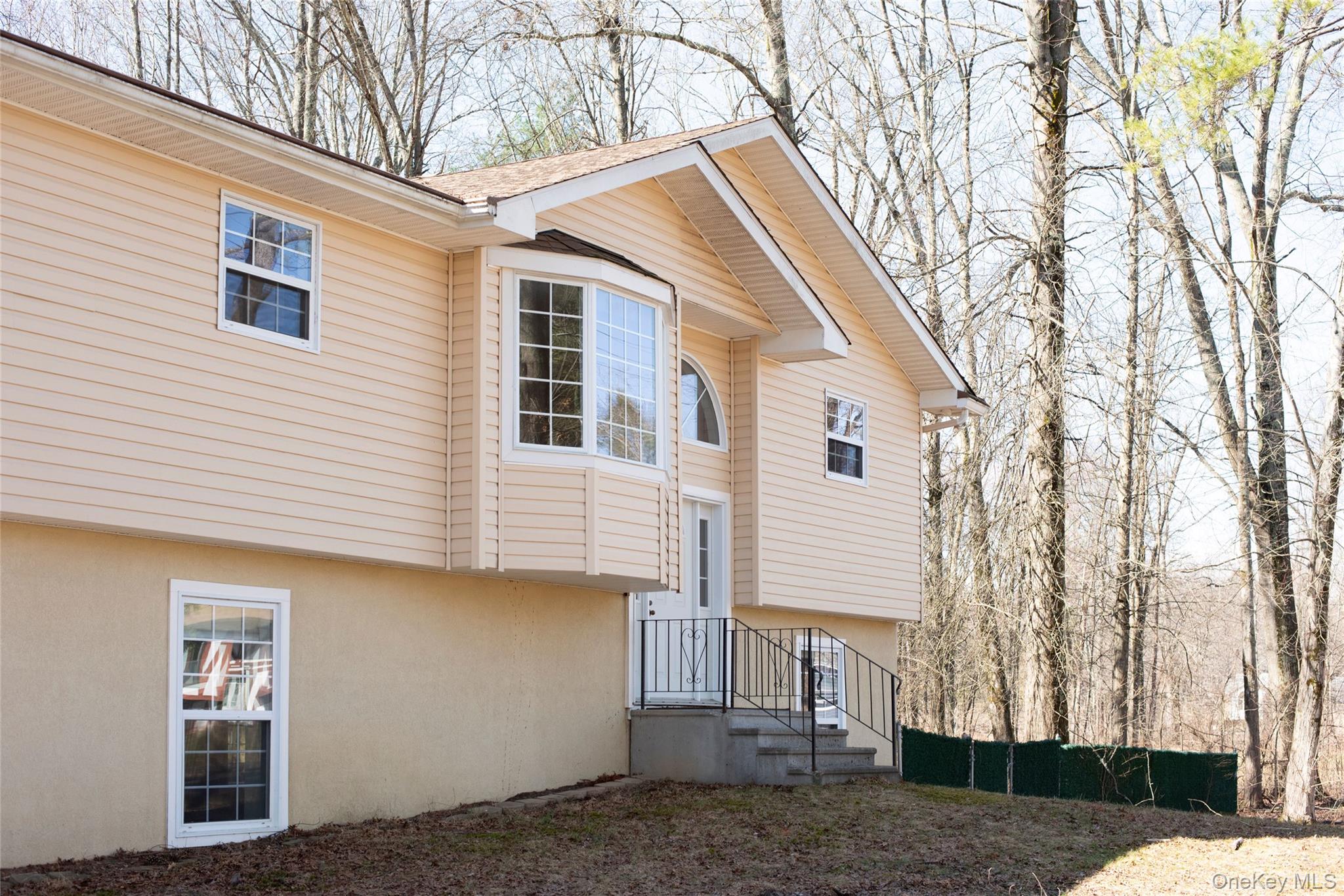 212 Rhinecliff Road Rhinebeck, NY 12572 - Photo 2 of 18 a view of a white house with a large tree