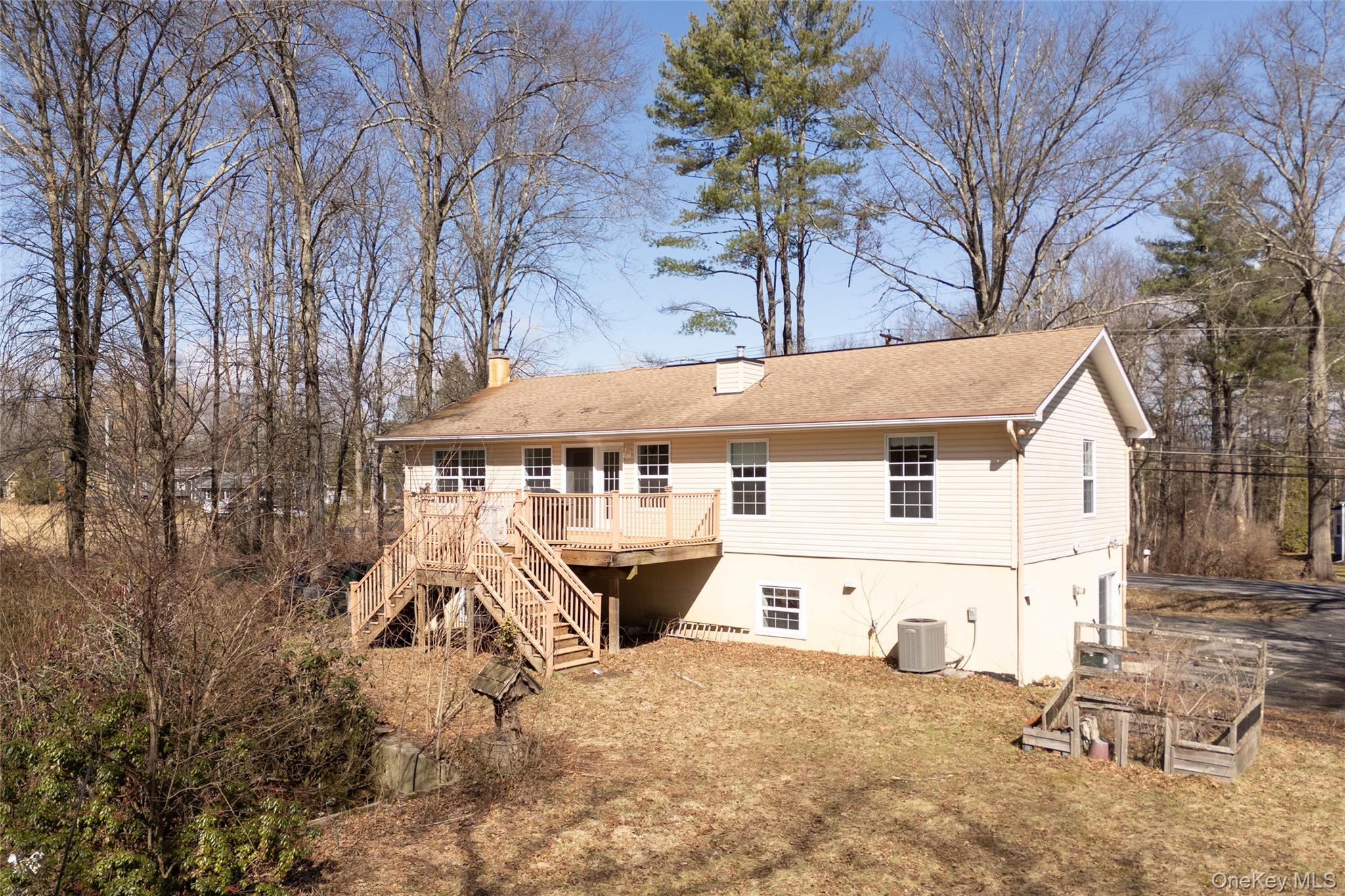 212 Rhinecliff Road Rhinebeck, NY 12572 - Photo 4 of 18 a view of a white house with a yard and a large tree