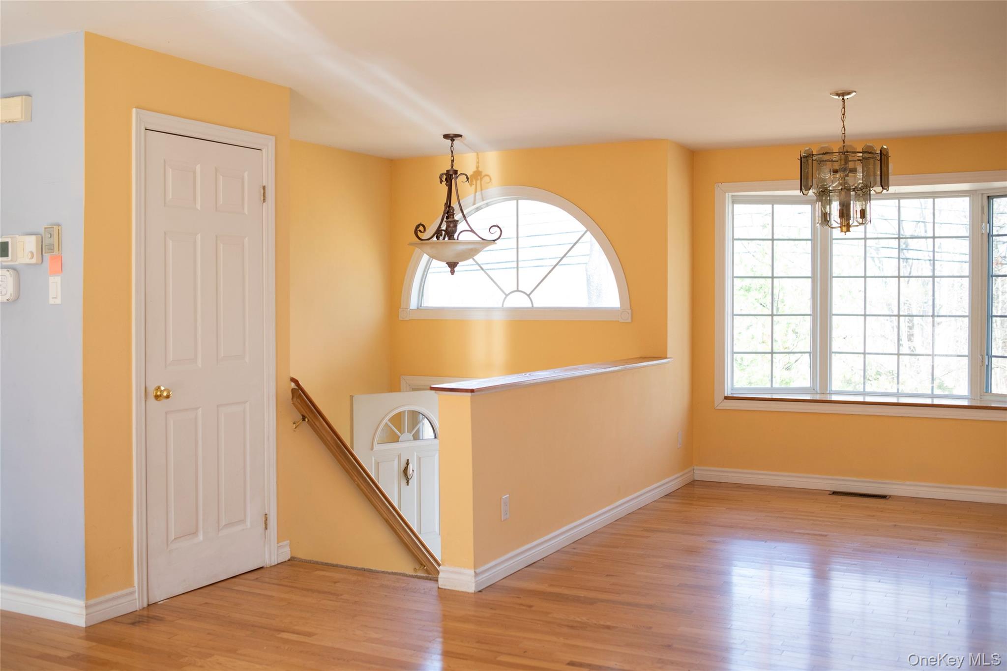 212 Rhinecliff Road Rhinebeck, NY 12572 - Photo 5 of 18 a view of a room with wooden floor and windows