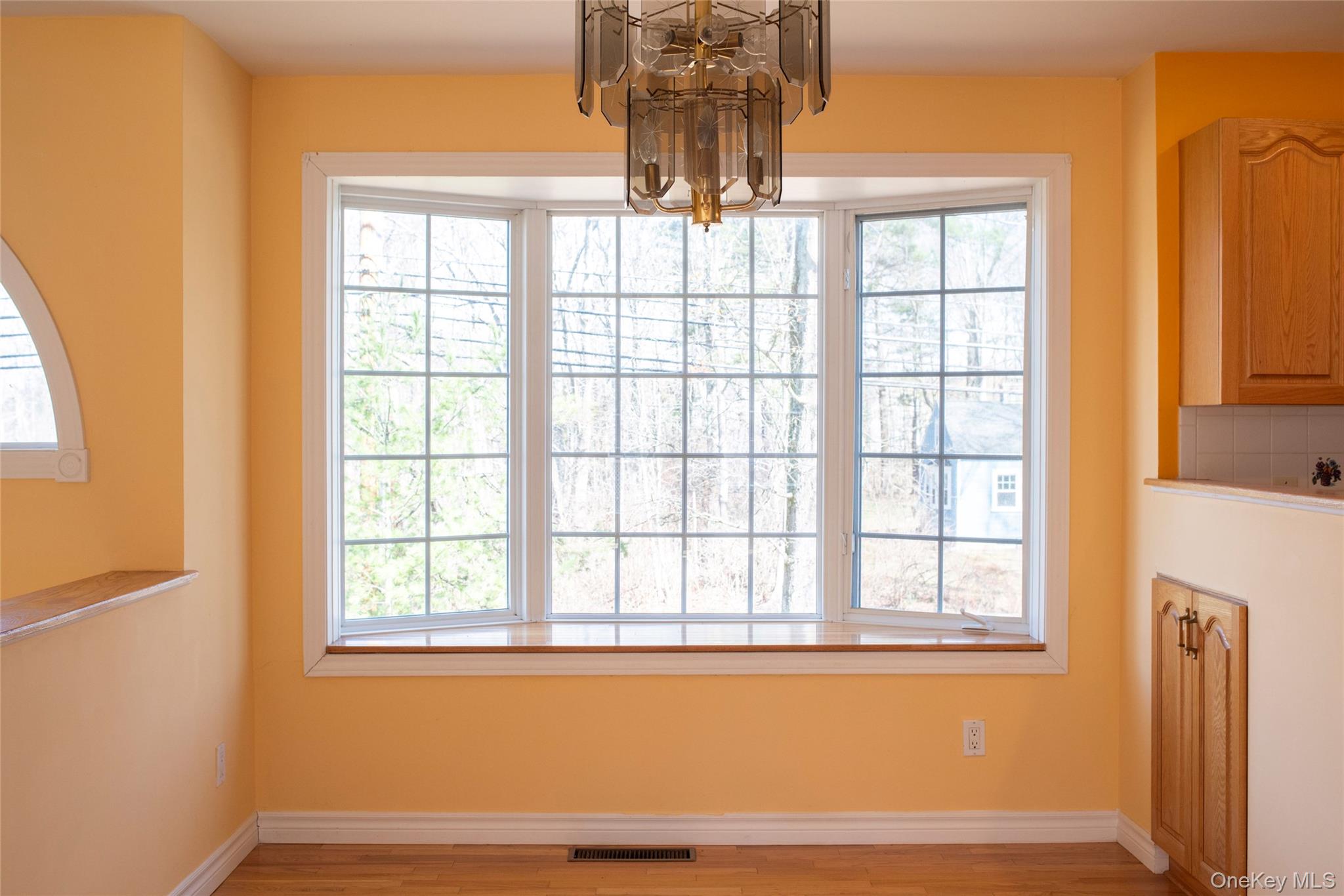 212 Rhinecliff Road Rhinebeck, NY 12572 - Photo 8 of 18 a view of empty room with wooden floor and fan