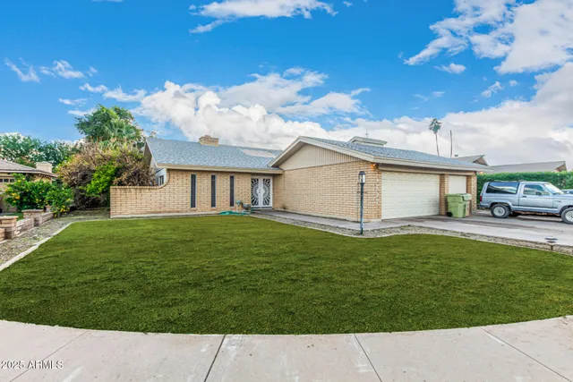 a house view with a garden space