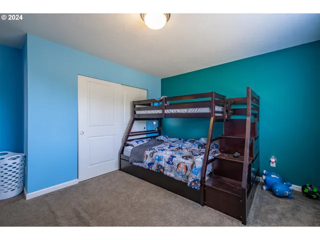 a bedroom with bed and a window