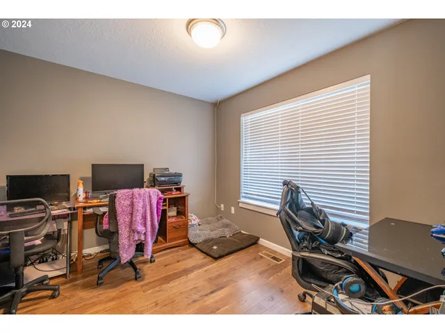 a workspace with furniture and a window